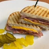 Grill , Ham, Cheese, Sandwich. · Sourdough bread, ham, American cheese, Swiss cheese.