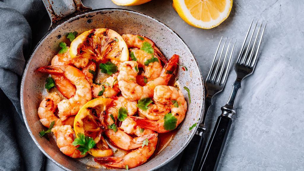 Camaron Al Mojo De Ajo · Grilled shrimp marinated with a creamy garlic sauce.