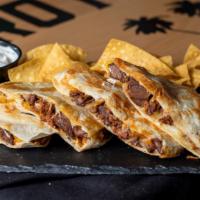 Quesadilla · Tortilla Filled with Cheese and Meat of your Choice then grilled to melted perfection.