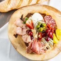 Antipasto Tray · Cured meats, assorted cheese, olives and fruit.
