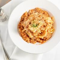 Homemade Pappardelle & Bolognese · Ragu made with grass-fed Niman ranch ground beef and organic ground pork.