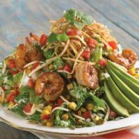 Southwest Avocado Salad · Iceberg romaine, a blend of three cheeses and tortilla strips tossed in chipotle ranch dress...