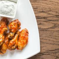 Buffalo Wings · Spicy fried wings served with celery sticks and blue cheese.