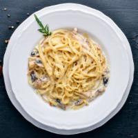 Portobello Sun-Dried Tomato Pasta · Yummy pasta With garlic and basil tossed with fettuccine in parmesan cream sauce.