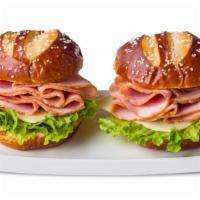 Ham Pretzel Bun Sandwich  · Pretzel bun with ham and cheese.
