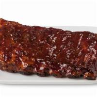 1/2 Rack Of Ribs  · Hot 1/2 rack of ribs with BBQ sauce.