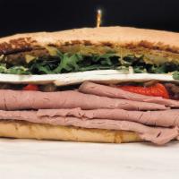 Wright Flyer · Roast Beef, Brie Cheese, Roasted Red Bell Pepper, Caramelized Onion, Arugula & Mayo on a Fre...