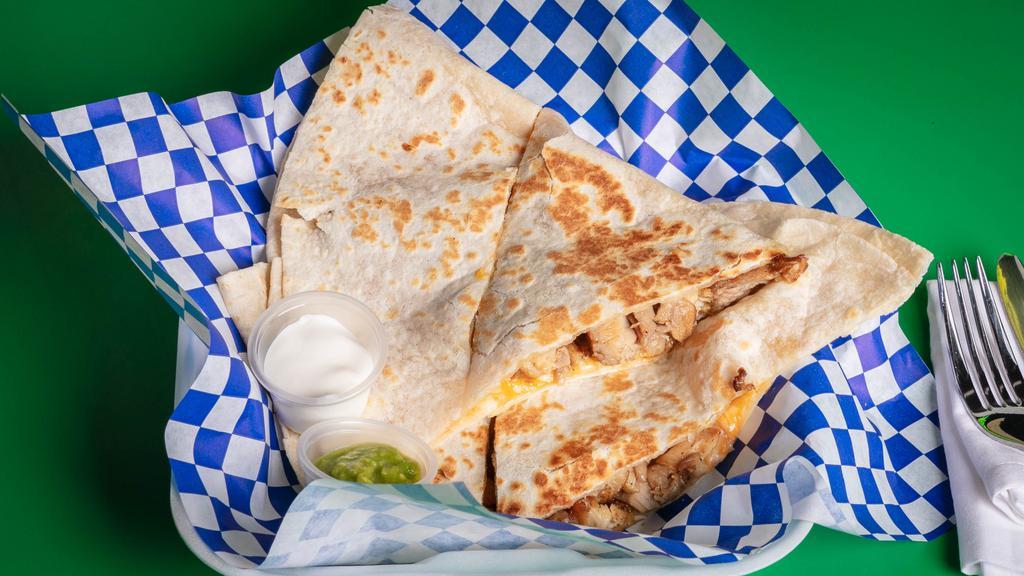 Meat Quesadilla · sour cream and guacamole on the side