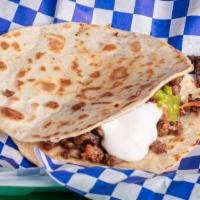 Muilta · consists of a crispy tortilla filled with chunks of grilled meat, cheese, and salsa or guaca...
