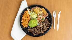Carnitas Plate · Choice of meat: asada, adobada or pork, with a side of lettuce topped with guacamole and sour cream served with rice and beans and your choice of corn or flour tortillas