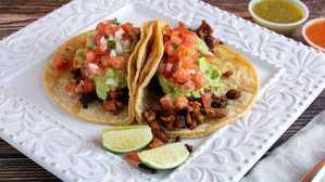 Two Beef Tacos · 2 beef tacos. served with rice and beans.