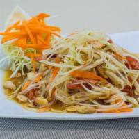 Thai Papaya Salad · Shredded green papaya, tomatoes, carrots, peanuts, and green beans with spicy chili lime dre...