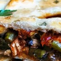 Combo Calzone · Italian turnover stuffed with pepperoni, sausage, mushrooms, onions, olives and bell peppers.