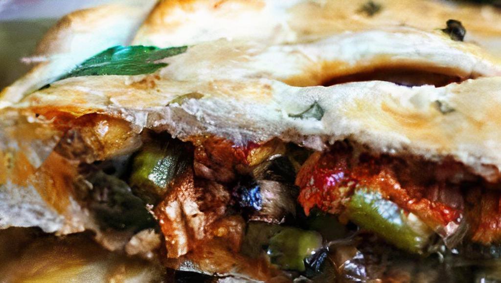 Combo Calzone · Italian turnover stuffed with pepperoni, sausage, mushrooms, onions, olives and bell peppers.