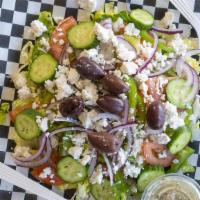 Greek Salad · Romaine lettuce, red onions, Greek olives, tomatoes, cucumbers, bell peppers and feta cheese...