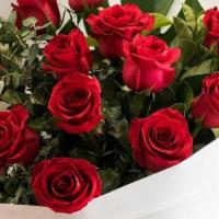 Dozen Red Roses In A Vase · 12 long stem red roses beautifully arranged with baby's breath in a vase.