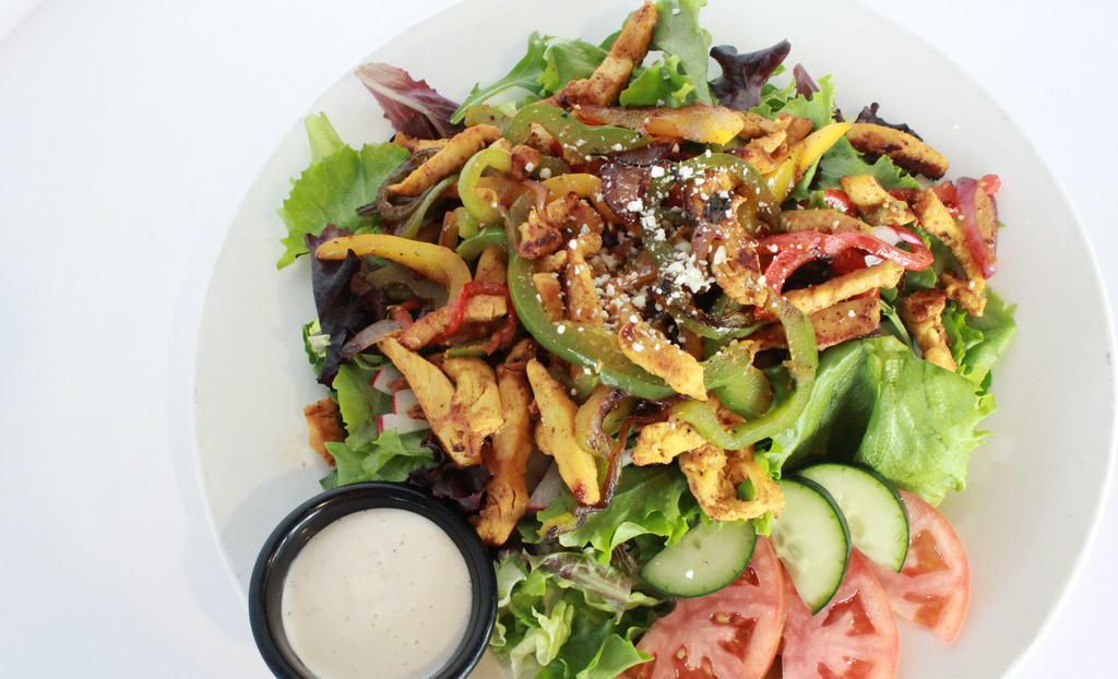 Chicken Fajita Salad · Grilled Chicken breast mixed with bell Peppers, Onions and Mushrooms over romaine Lettuce spring mix, Tomatoes, Cucumbers, sliced radishes, sprinkled with Cotija Cheese, ranch Dressing on the side.