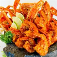 Molcajete De Mariscos · Sauteed peel on Shrimp, Crab Legs and whole fried mojarra fish in our spicy citrus sauce ser...