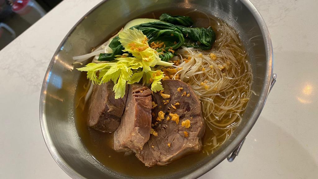 Braised Beef Noodle Soup · This popular Thai street soup will warm your soul!! Made the traditional way with tender braised beef, savory five spices broth, beansprout, bok Choy, celery and rice vermicelli noodles top with fried garlic & farm fresh cilantro**comes peppery  spice**