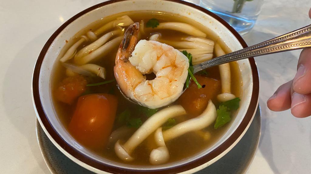 Tom Yum(Bowl) · A savory sour soup with mushrooms, traditionally seasoned with lemongrass, fresh galangal, kaffir lime leaves, chili and lime juice.