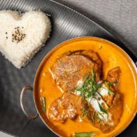 Braised Beef Panang Curry · Fresh Atlantic salmon braised in panang sauce, served on a bed of steamed green bean and car...