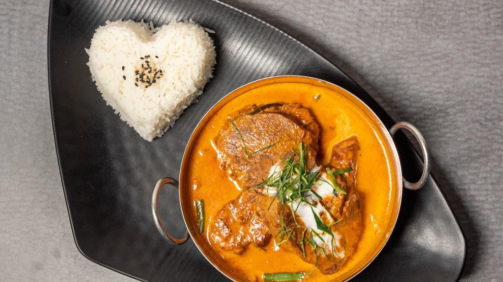 Braised Beef Panang Curry · Fresh Atlantic salmon braised in panang sauce, served on a bed of steamed green bean and carrot.