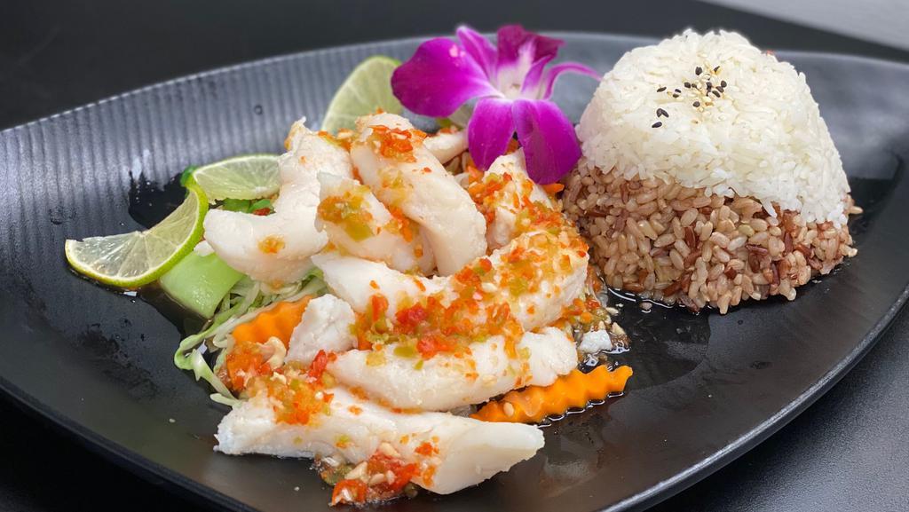 Steamed Fish With Spicy Lime Vinaigrette  · Sole fillet fish topped served with Spicy garlic lime vinaigrette . Served on a bed of steamed bokChoy, carrot and cabbage. . Served with your choice of jasmine rice or organic brown rice.