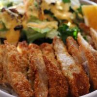 Tonkatsu · Fried breaded pork cutlet, steamed rice and salad.