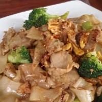 Pad See-Ew · Choice of meat stir fried with flat noodles, broccoli, egg and black soy sauce.
