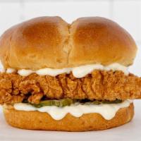 New! Crispy Chicken Sandwich · Two juicy all white meat chicken strips, between a perfectly toasted brioche bun, with pickl...