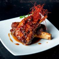 Sticky Ribs · Twice cooked Pork Rib, Cilantro, served with Hoisin Sweet Chili Sauce.