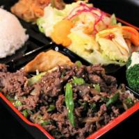 Bul-Go-Gi Box · Shredded beef ribeye, served with rice, salad, jabchae, and a potsticker.