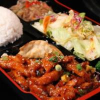 Spicy Chicken Box · Chopped chicken with a spicy marinade, served with rice, salad, jabchae, and a potsticker.