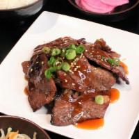 Teriyaki Beef Dinner · Beef boneless short ribs with a traditional marinade and topped with teriyaki sauce, served ...