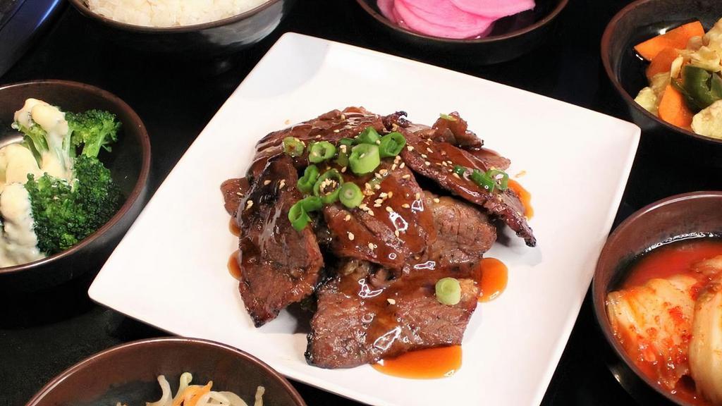 Teriyaki Beef Dinner · Beef boneless short ribs with a traditional marinade and topped with teriyaki sauce, served with rice and Korean side dishes.