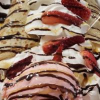 Ice Cream Crêpe · Warm thin pancake topped with Nutella, choice of fresh fruit, whipped cream chocolate, caram...