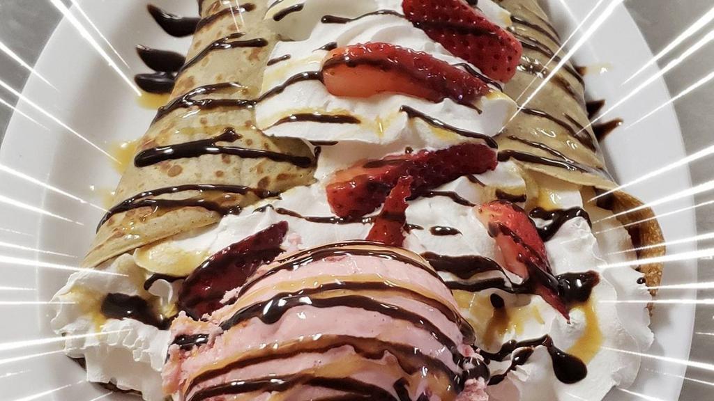 Ice Cream Crêpe · Warm thin pancake topped with Nutella, choice of fresh fruit, whipped cream chocolate, caramel and 1 ice cream scoop of your choice. Flavor Ice creams; vanilla, strawberry, rocky road, cotton candy, cookies n cream, pistacio, rainbow sorbet, mango sorbet, butter pecan,