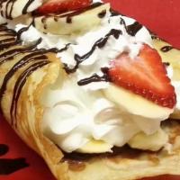 Fruit Crêpe · Warm thin pancake topped with Nutella, choice of fresh fruit, whipped cream chocolate, and c...