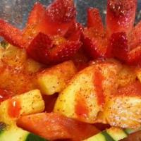 Pina Loca · Half pineapple filled with other seasonal fresh fruits like watermelon, cucumber, mango, pin...