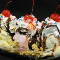 Banana Split · 1 sliced banana cut in half topped with 3 scoops of ice cream of your choice, whipped cream ...