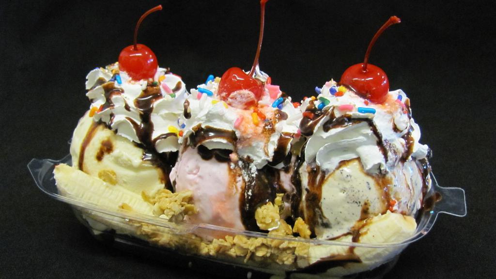 Banana Split · 1 sliced banana cut in half topped with 3 scoops of ice cream of your choice, whipped cream chocolate, caramel, granola, coconut flake, sprinkles and cherries on top. Flavor Ice creams; vanilla, strawberry, rocky road, cotton candy, cookies n cream, pistacio, rainbow sorbet, mango sorbet, butter pecan,