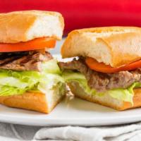 Steak Rib Eye Sandwich · On a toasted French Roll, with mayo, lettuce & tomato.