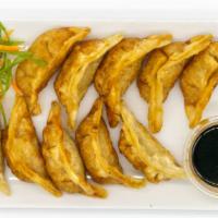 Pot Stickers · 10 pieces. Pan fried chicken dumplings filled with green onions.