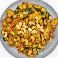Cashew Chicken · Sliced white meat chicken with zucchini, carrots and celery stir fried in brown sauce topped...