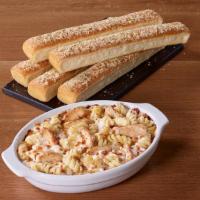 Creamy Chicken Alfredo · Grilled chicken and rotini oven-baked in our Alfredo sauce.
