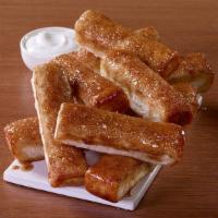 Cinnamon Sticks · Sprinkled with Cinnamon and sugar and served with icing dipping sauce.