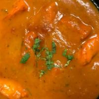 Chicken Tikka Masala · Boneless white meat marinated and roasted in tandoor then cooked with tomato and cream sauce...