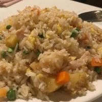 Pineapple Fried Rice · Chicken and shrimp and rice, Stir fried with eggs, scallions, peas, carrots pineapple. (no s...