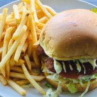 Fish Sandwich · Cod fish lightly fried to golden. Served on brioche bun with lettuce, tomato and tartar sauc...