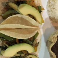Tacos De Mahi Mahi · Two Mahi Mahi tacos, cabbage, pico de gallo, avocado, chipotle sauce, served with white rice...